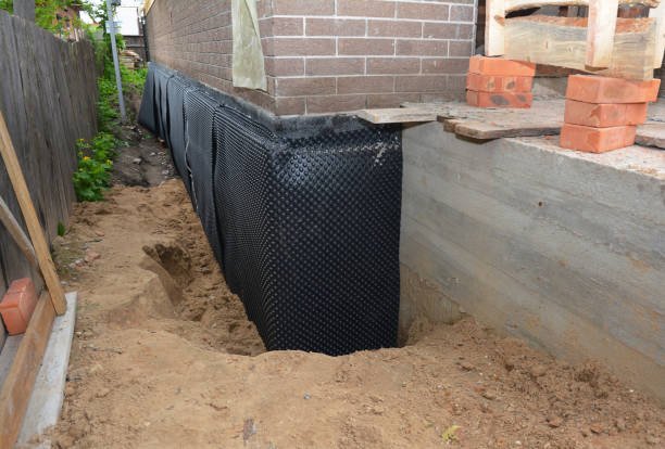 Happy homeowners after waterproofing job in Hamel
